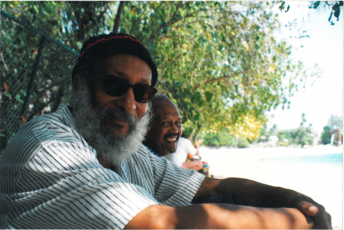 Kamau with John La Rose on the shores of Barbados, was taken by Sarah White on their visit in 1999